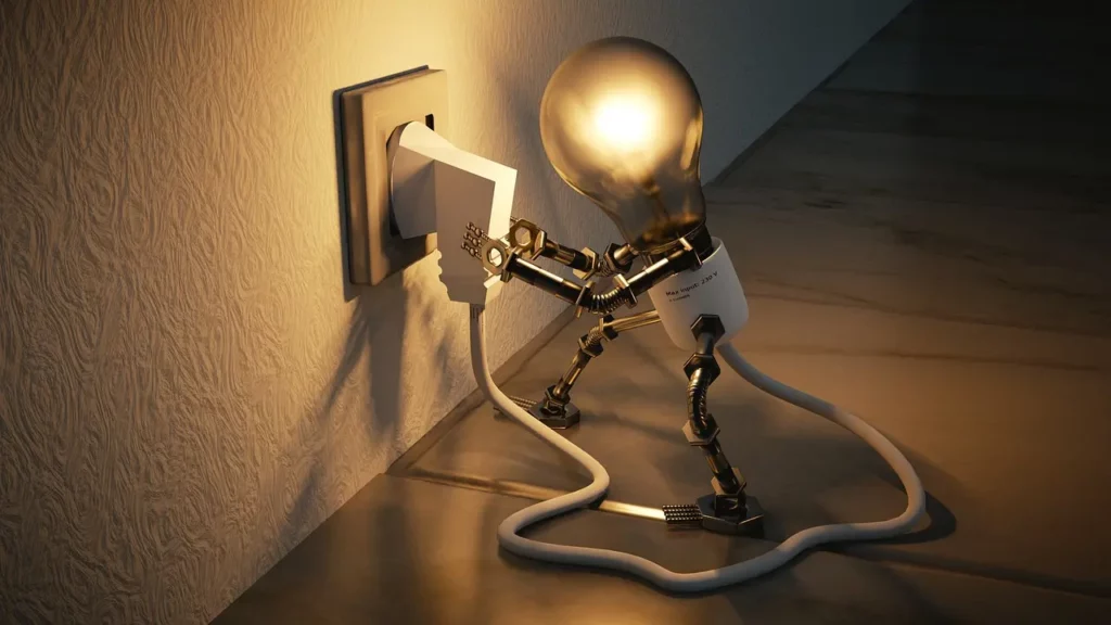 Illustration d'une ampoule qui branche sa prise pour s'illuminer. Elle symbolise l'année personnelle 3 pour calculer et comprendre les années personnelles en numérologie.